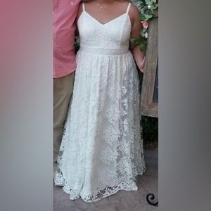 Plus sized bridal dress with sequined laced overlay